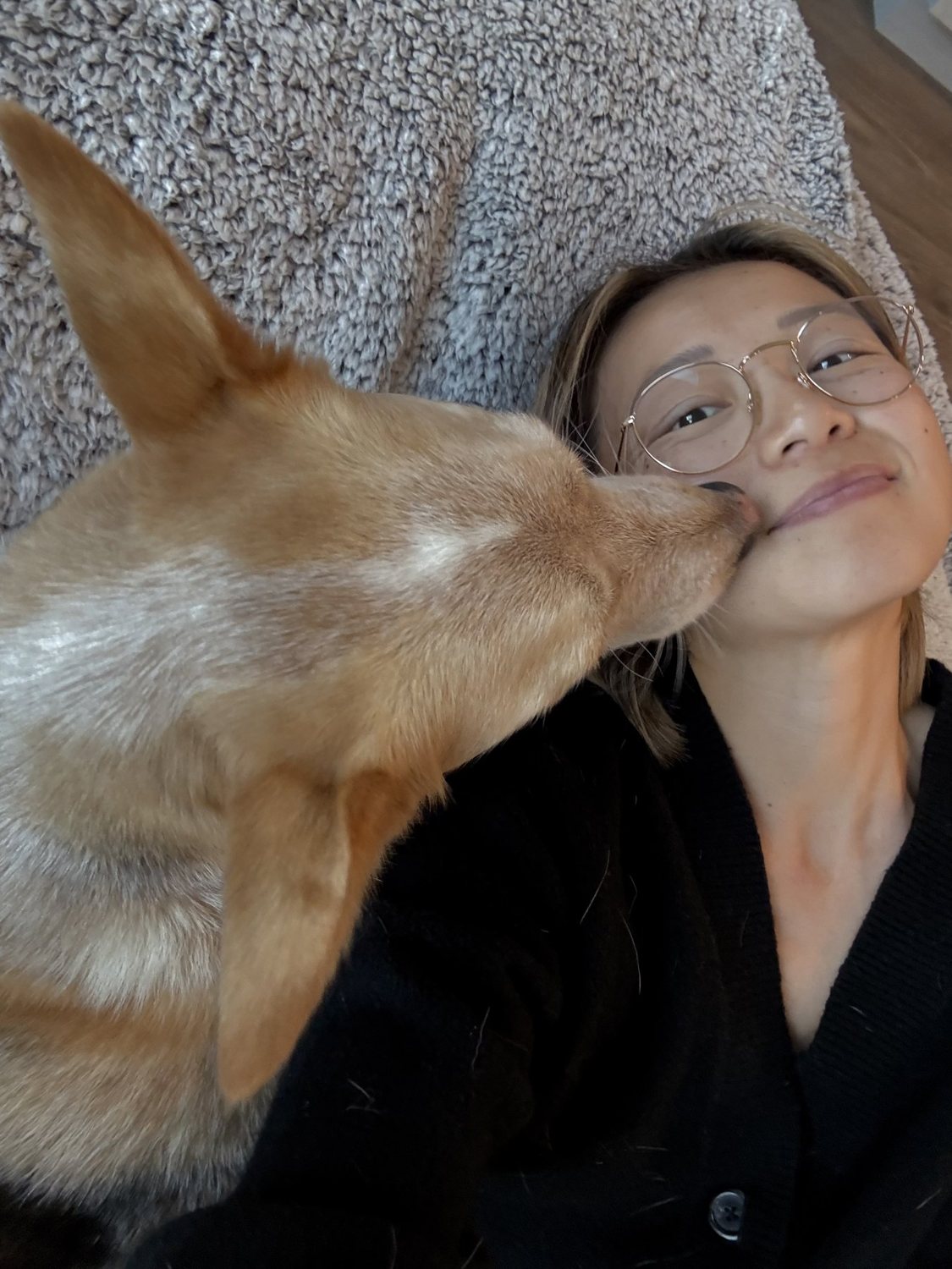 Toby leaning in to give Diana a kiss on a trail